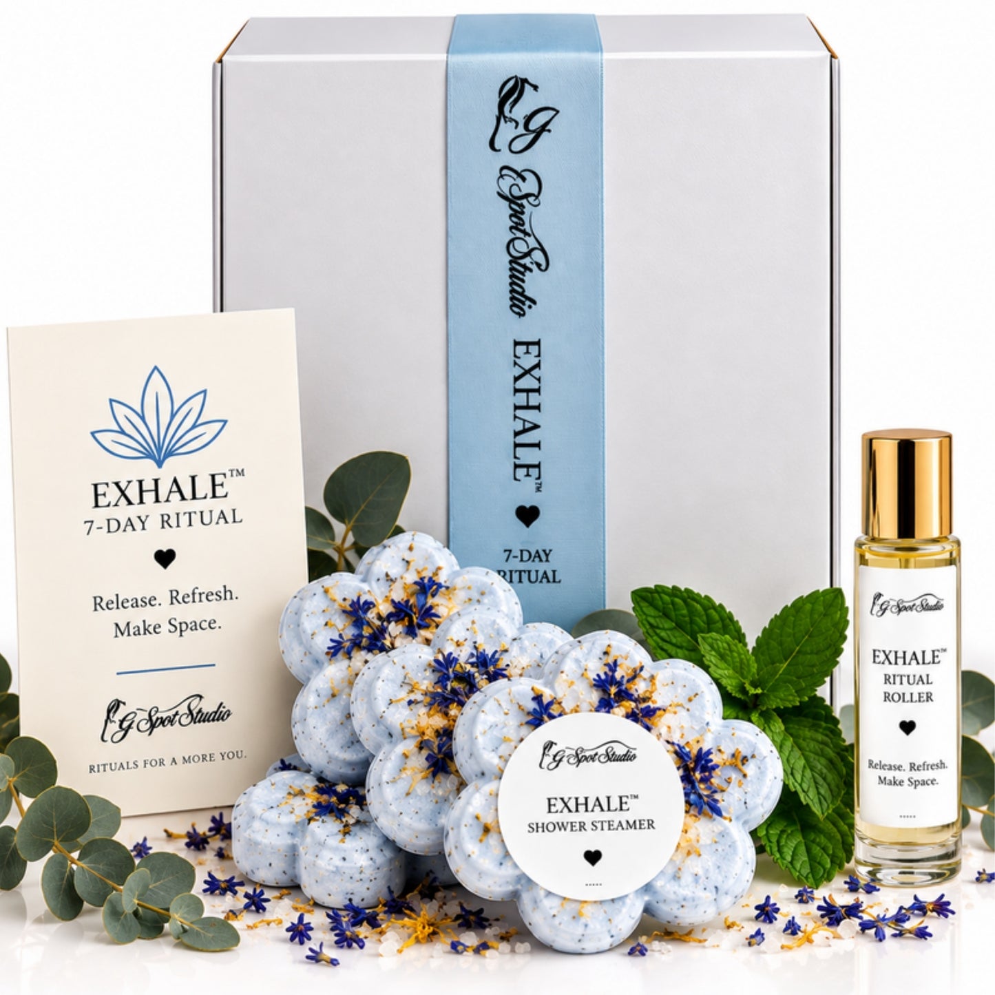 EXHALE 7-Day Ritual kit by G Spot Studio: white gift box with blue band, ritual card, eucalyptus mint shower steamers, and ritual roller