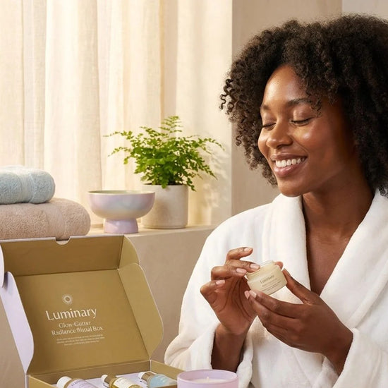 Luminary Glow-Getter: a smiling Black woman opening her Luminary ritual box