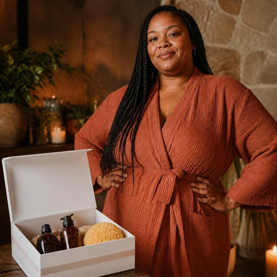 Phoenix Reclaimer: a confident curvy Black woman with long braids beside her open white ritual box of oils