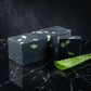 You will be generating high-quality product photos for an online stores product page. The product images should closely match the original products.
      Here is the prompt (IMPORTANT!): """A high-resolution studio shot of the 'Charcoal Aloe Soap' set aga
