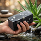 You will be generating high-quality product photos for an online stores product page. The product images should closely match the original products.
      Here is the prompt (IMPORTANT!): """An artistic, close-up product shot of the 'Charcoal Aloe Soap' in