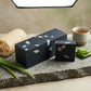 You will be generating high-quality product photos for an online stores product page. The product images should closely match the original products.
      Here is the prompt (IMPORTANT!): """A dynamic, editorial-style image of the 'Charcoal Aloe Soap' disp