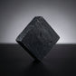 You will be generating high-quality product photos for an online stores product page. The product images should closely match the original products.
      Here is the prompt (IMPORTANT!): """A high-resolution studio shot of the Charcoal Soap prominently po