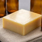 You will be generating high-quality product photos for an online stores product page. The product images should closely match the original products.
      Here is the prompt (IMPORTANT!): """A detailed macro shot of Egyptian Musk Soap resting atop a linen 