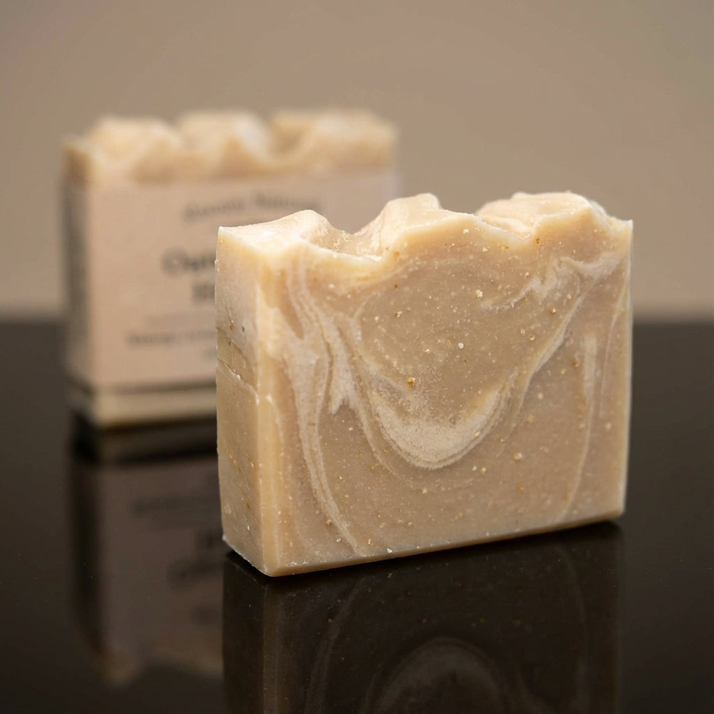 You will be generating high-quality product photos for an online stores product page. The product images should closely match the original products.
      Here is the prompt (IMPORTANT!): """A high-resolution studio shot of the oatmeal honey soap, placed o