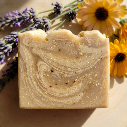 You will be generating high-quality product photos for an online stores product page. The product images should closely match the original products.
Here is the prompt (IMPORTANT!): """A close-up, macro-style image of the oatmeal honey soap in natura