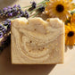 You will be generating high-quality product photos for an online stores product page. The product images should closely match the original products.
      Here is the prompt (IMPORTANT!): """A close-up, macro-style image of the oatmeal honey soap in natura