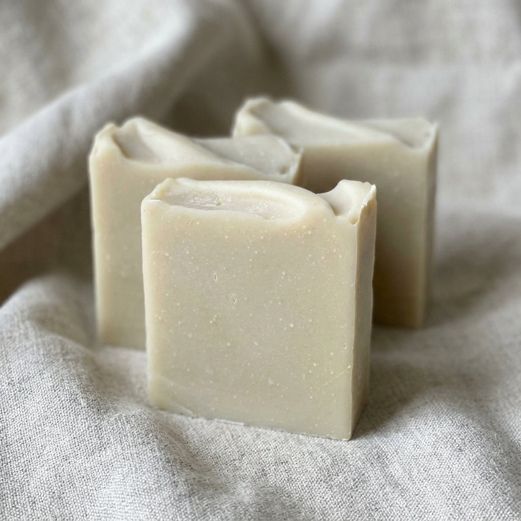 You will be generating high-quality product photos for an online stores product page. The product images should closely match the original products.
      Here is the prompt (IMPORTANT!): """Capture a close-up of the 'Sea Moss + Bentonite Soap' set against
