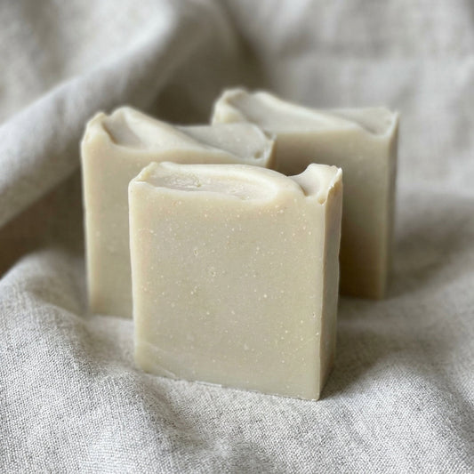 You will be generating high-quality product photos for an online stores product page. The product images should closely match the original products.
Here is the prompt (IMPORTANT!): """Capture a close-up of the 'Sea Moss + Bentonite Soap' set against
