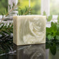 You will be generating high-quality product photos for an online stores product page. The product images should closely match the original products.
      Here is the prompt (IMPORTANT!): """A high-resolution studio shot of the 'Tea Tree and Mint Soap' pla
