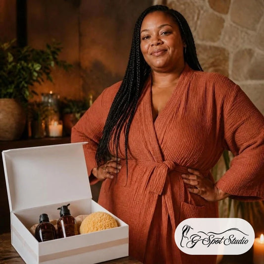 Phoenix Reclaimer Renewal Ritual Box: a confident woman with braids beside her open white ritual box of oils